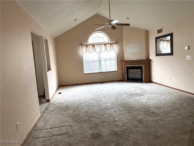 39 Village Ct, Columbiana, OH 44408 - unfurnished living room featuring carpet flooring, ceiling fan, lofted ceiling, a fireplace, and baseboards