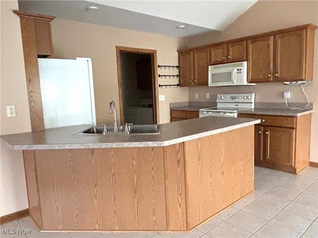 39 Village Ct, Columbiana, OH 44408 - kitchen featuring white appliances, light tile patterned flooring, a sink, a peninsula, and brown cabinets