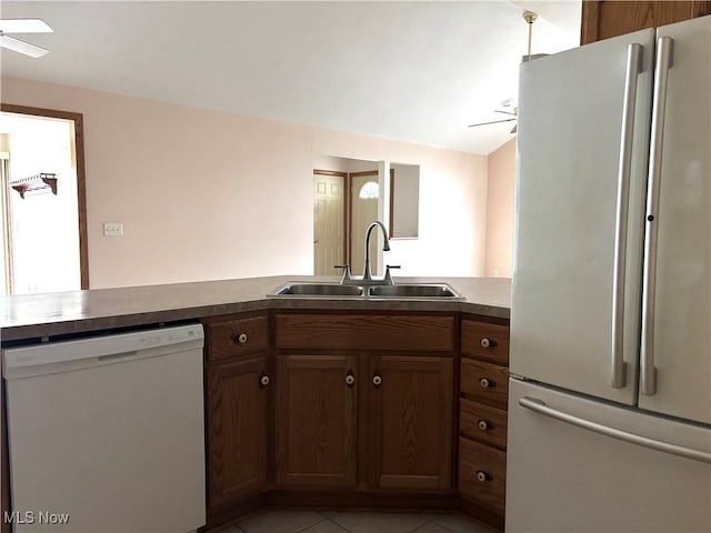 39 Village Ct, Columbiana, OH 44408 - kitchen featuring white appliances, a sink, a ceiling fan, and light tile patterned floors
