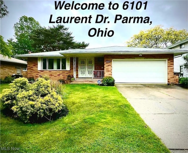 6101 Laurent Dr, Parma, OH 44129 - view of front of property featuring brick siding, an attached garage, and a front yard