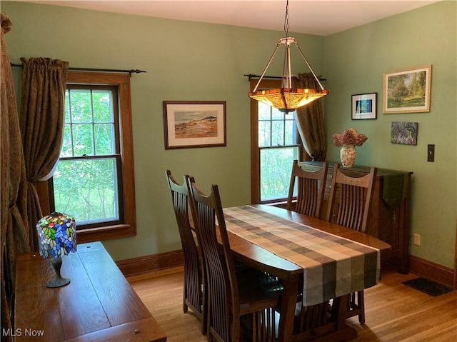 7434 Birkner Dr, Kent, OH 44240 - dining area with light wood-type flooring and baseboards