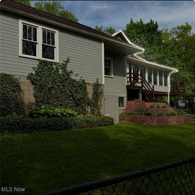 7434 Birkner Dr, Kent, OH 44240 - view of property exterior featuring a sunroom and stairway