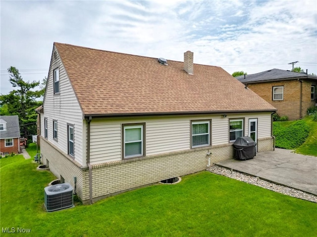 213 Pico St, Steubenville, OH 43952 - back of property featuring central air condition unit, a chimney, a patio area, and a yard
