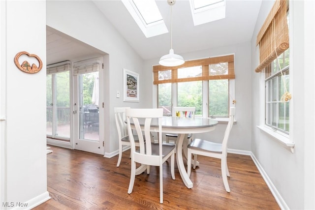 23935 Duffield Rd, Shaker Heights, OH 44122 - dining space featuring lofted ceiling, plenty of natural light, wood finished floors, a skylight, and baseboards