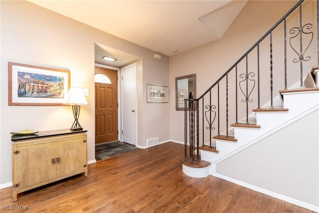 23935 Duffield Rd, Shaker Heights, OH 44122 - entrance foyer with wood finished floors, baseboards, and stairway