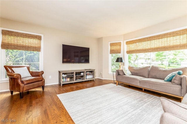 23935 Duffield Rd, Shaker Heights, OH 44122 - living room featuring plenty of natural light, wood finished floors, and baseboards