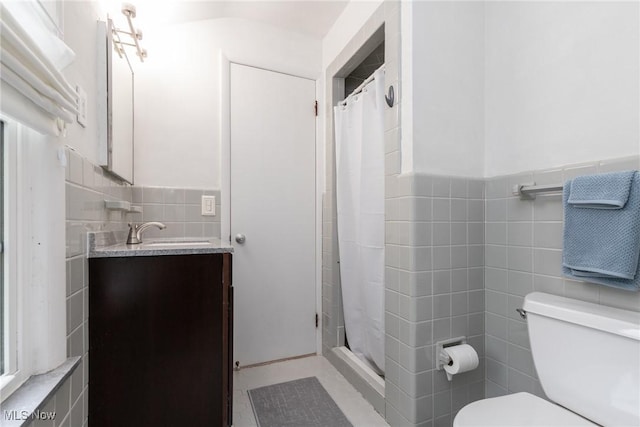 23935 Duffield Rd, Shaker Heights, OH 44122 - full bath featuring tile walls, toilet, vanity, a shower stall, and a wainscoted wall
