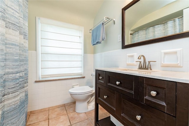 23935 Duffield Rd, Shaker Heights, OH 44122 - full bathroom with tile walls, tile patterned floors, vanity, toilet, and a wainscoted wall