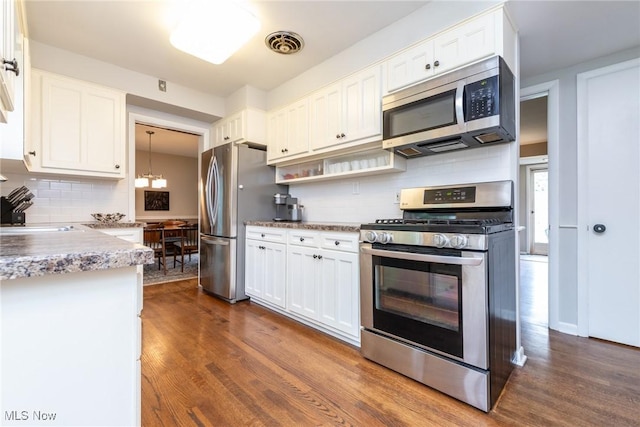 23935 Duffield Rd, Shaker Heights, OH 44122 - kitchen featuring stainless steel appliances, dark wood finished floors, and white cabinetry