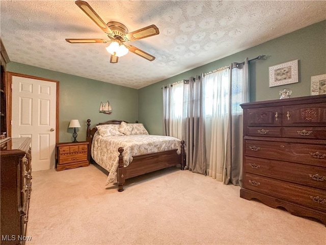 2308 Bears Den Rd, Youngstown, OH 44511 - bedroom featuring light carpet, a textured ceiling, and ceiling fan