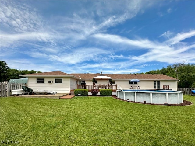 2308 Bears Den Rd, Youngstown, OH 44511 - back of property featuring a wooden deck and an outdoor pool