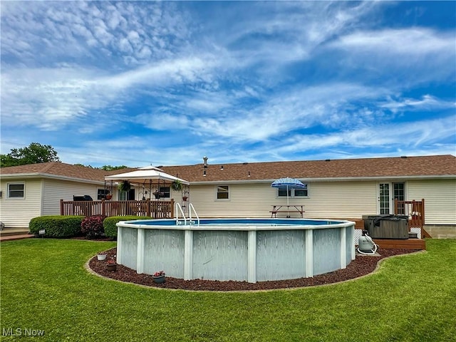 2308 Bears Den Rd, Youngstown, OH 44511 - back of house with a gazebo, a yard, an outdoor pool, and a wooden deck