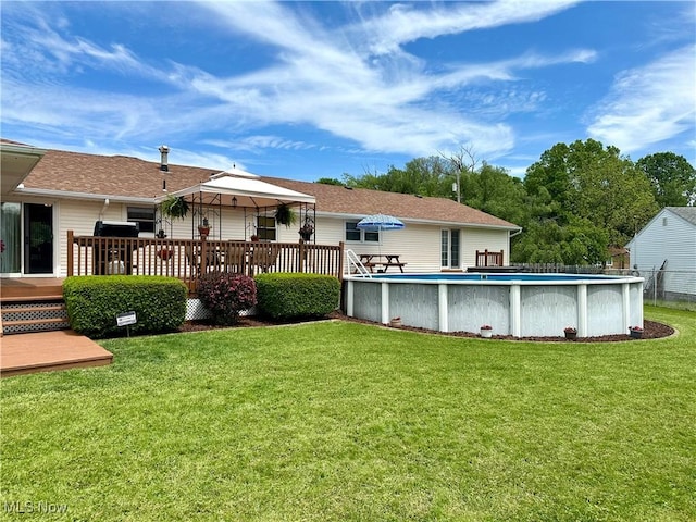 2308 Bears Den Rd, Youngstown, OH 44511 - back of house with a deck, an outdoor pool, and roof with shingles