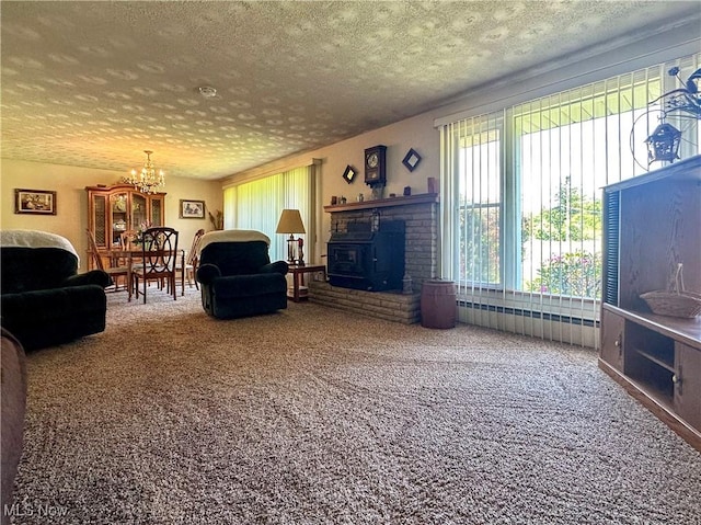2308 Bears Den Rd, Youngstown, OH 44511 - carpeted living area with a textured ceiling and a chandelier
