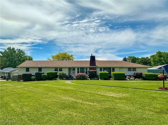2308 Bears Den Rd, Youngstown, OH 44511 - ranch-style house featuring a front yard and a chimney