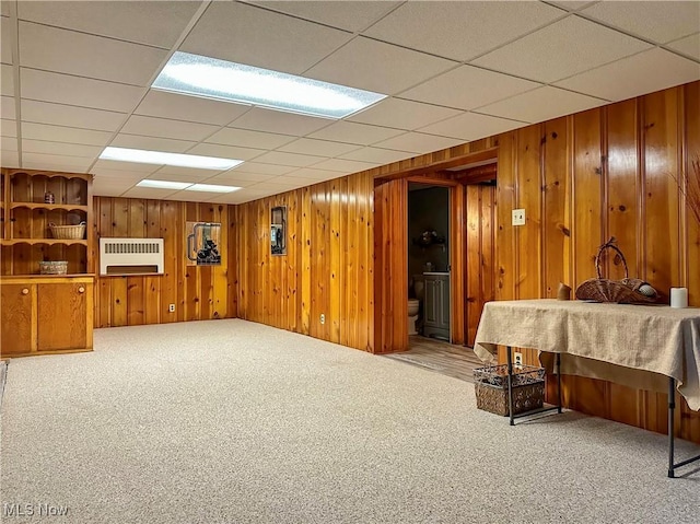 2308 Bears Den Rd, Youngstown, OH 44511 - finished below grade area featuring carpet floors, wood walls, heating unit, and a paneled ceiling