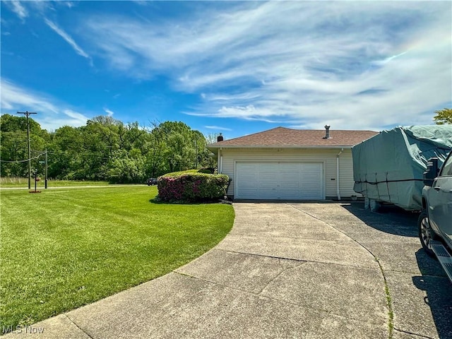 2308 Bears Den Rd, Youngstown, OH 44511 - view of side of property with a yard, driveway, and a garage