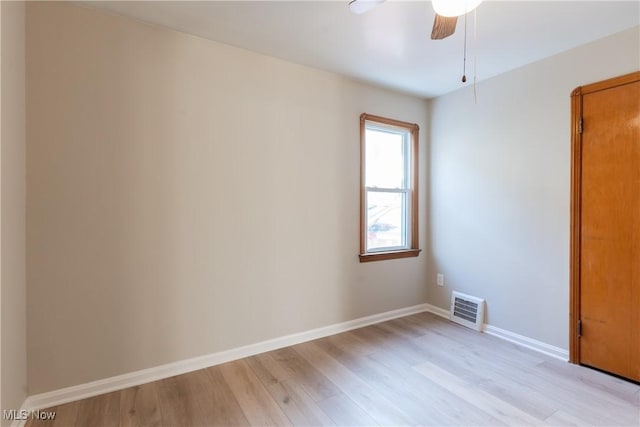 4827 E 88th St, Garfield Heights, OH 44125 - unfurnished room featuring light wood-type flooring, a ceiling fan, and baseboards
