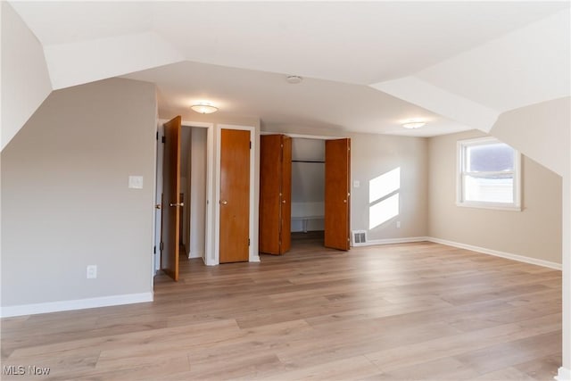 4827 E 88th St, Garfield Heights, OH 44125 - additional living space with baseboards and light wood-type flooring