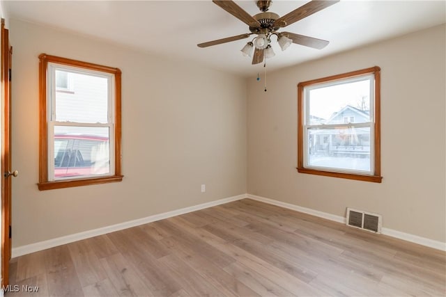 4827 E 88th St, Garfield Heights, OH 44125 - unfurnished room featuring light wood-style flooring, baseboards, and ceiling fan