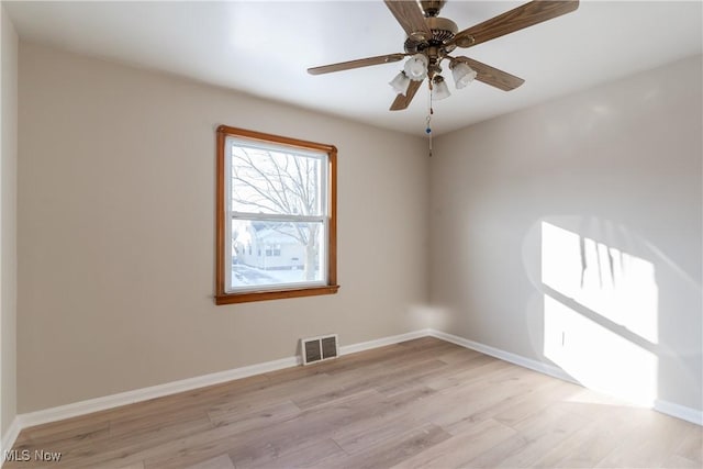 4827 E 88th St, Garfield Heights, OH 44125 - spare room featuring light wood-style floors, a ceiling fan, and baseboards