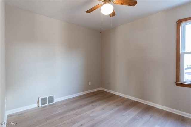 4827 E 88th St, Garfield Heights, OH 44125 - spare room with light wood finished floors, ceiling fan, and baseboards