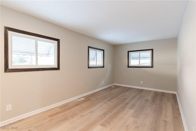 4827 E 88th St, Garfield Heights, OH 44125 - unfurnished room featuring light wood-type flooring and baseboards