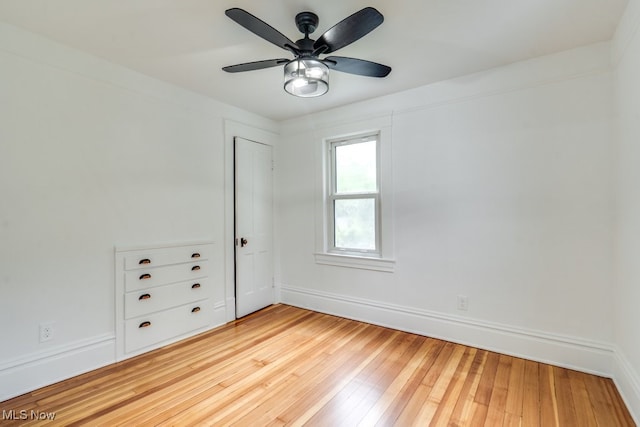 235 Elm St, Oberlin, OH 44074 - unfurnished room featuring light wood-style flooring, a ceiling fan, and baseboards