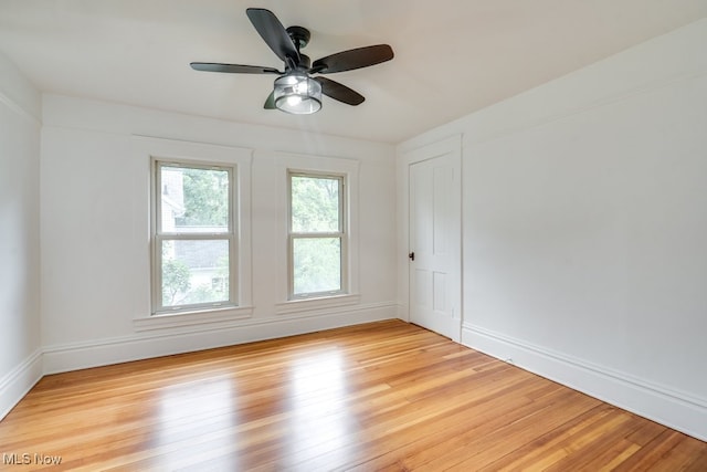 235 Elm St, Oberlin, OH 44074 - empty room featuring light wood-style flooring, ceiling fan, and baseboards