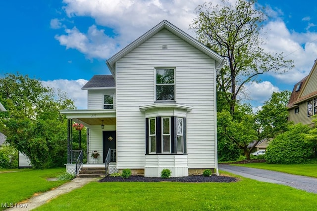 235 Elm St, Oberlin, OH 44074 - traditional home with covered porch and a front yard