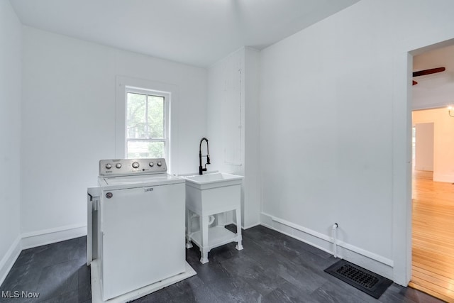 235 Elm St, Oberlin, OH 44074 - laundry area with washer / dryer and baseboards