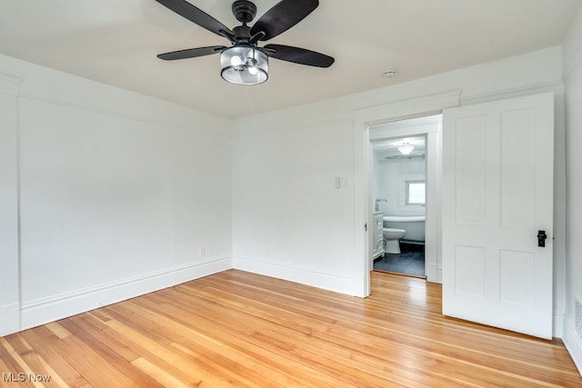 235 Elm St, Oberlin, OH 44074 - empty room with a ceiling fan, light wood-style flooring, baseboards, and a smoke detector