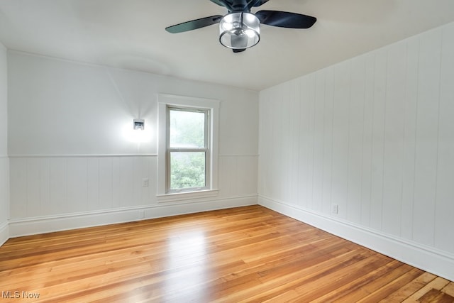 235 Elm St, Oberlin, OH 44074 - unfurnished room featuring light wood-style floors, a ceiling fan, and baseboards