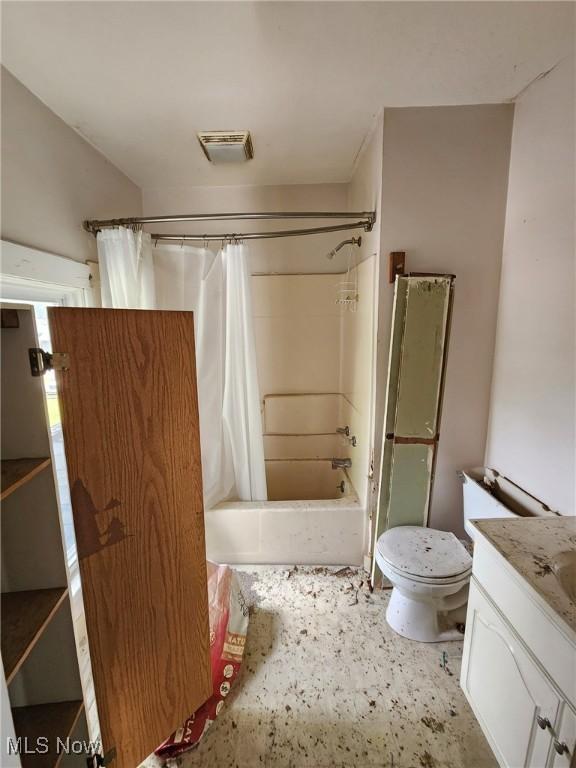 168 Whittlesey Ave, Norwalk, OH 44857 - full bath featuring vanity, shower / bathtub combination with curtain, and toilet