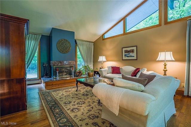 875 N Medina Line Rd, Akron, OH 44333 - living room with baseboard heating, wood finished floors, a fireplace, and high vaulted ceiling