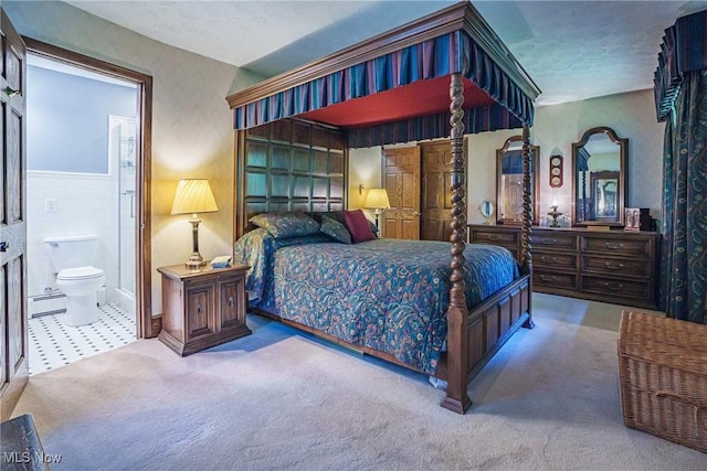 875 N Medina Line Rd, Akron, OH 44333 - bedroom featuring a baseboard radiator, carpet floors, and connected bathroom