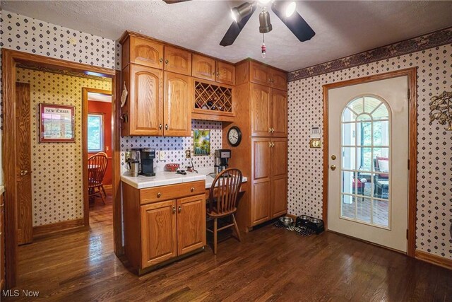 875 N Medina Line Rd, Akron, OH 44333 - kitchen with wallpapered walls, ceiling fan, dark wood finished floors, tile counters, and healthy amount of natural light