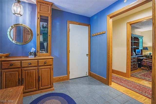 875 N Medina Line Rd, Akron, OH 44333 - corridor featuring baseboards and an office area