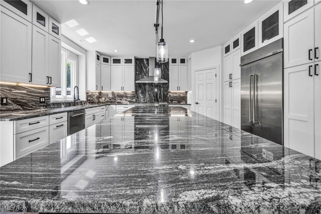 2344 Country Brook Dr, Hinckley, OH 44233 - kitchen featuring appliances with stainless steel finishes, decorative backsplash, white cabinetry, recessed lighting, and dark stone counters