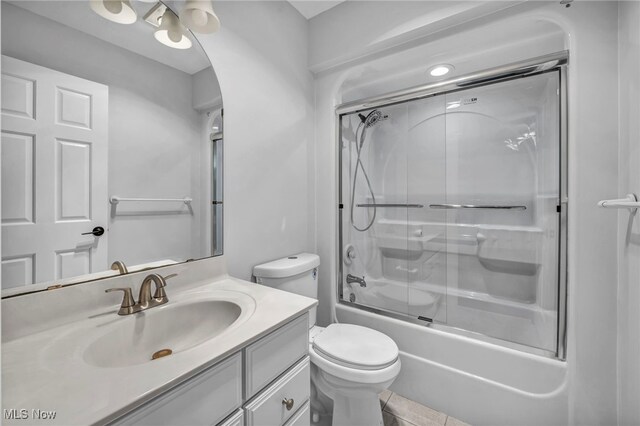 2344 Country Brook Dr, Hinckley, OH 44233 - full bathroom featuring vanity, combined bath / shower with glass door, toilet, and tile patterned flooring