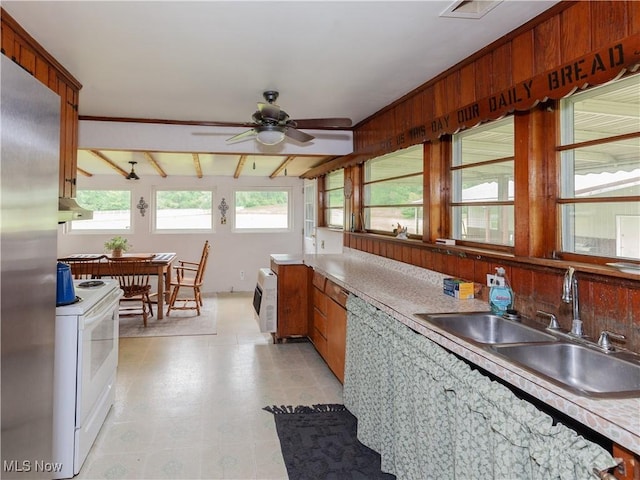 12209 Tinkers Creek Rd, Valley View, OH 44125 - kitchen featuring white range with electric stovetop, a sink, a ceiling fan, light countertops, and freestanding refrigerator