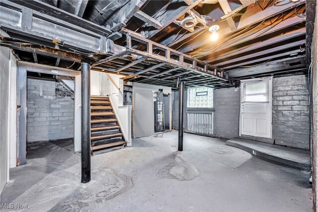 10234 Park Heights Rd, Cleveland, OH 44104 - basement with stairs and water heater