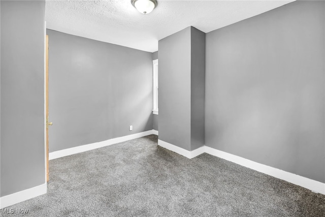 10234 Park Heights Rd, Cleveland, OH 44104 - carpeted spare room featuring a textured ceiling and baseboards