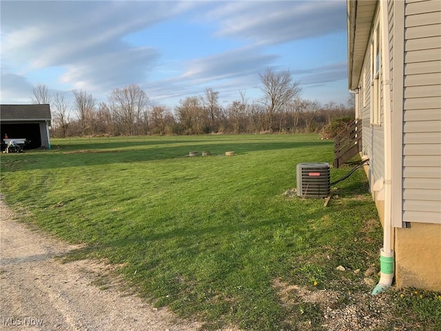 10677 Moss Rd, Lodi, OH 44254 - view of grassy yard featuring central AC