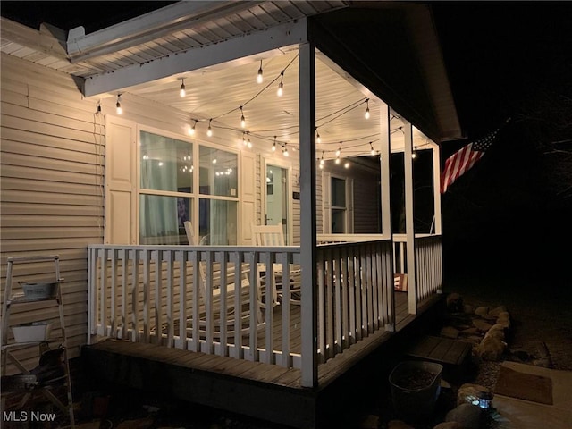10677 Moss Rd, Lodi, OH 44254 - deck at twilight featuring covered porch