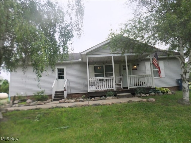 10677 Moss Rd, Lodi, OH 44254 - view of front of house featuring a front yard and a porch