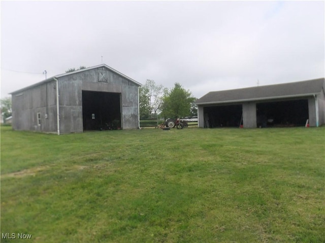 10677 Moss Rd, Lodi, OH 44254 - view of pole building featuring a lawn