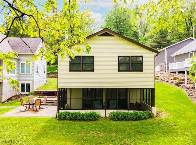 32094 Woodale Dr, Hanoverton, OH 44423 - back of property featuring a lawn, a patio area, and a sunroom