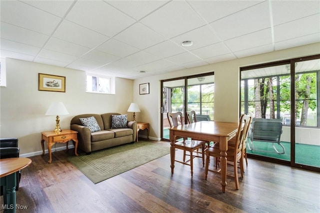 32094 Woodale Dr, Hanoverton, OH 44423 - dining area with wood finished floors, a paneled ceiling, and baseboards
