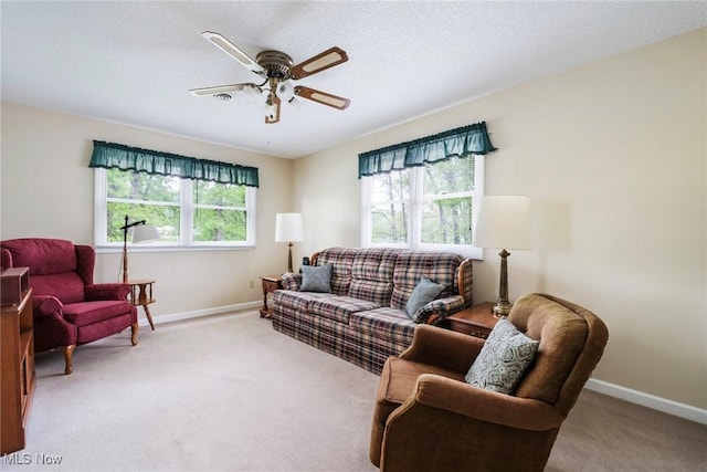 32094 Woodale Dr, Hanoverton, OH 44423 - living area featuring light carpet, ceiling fan, and baseboards